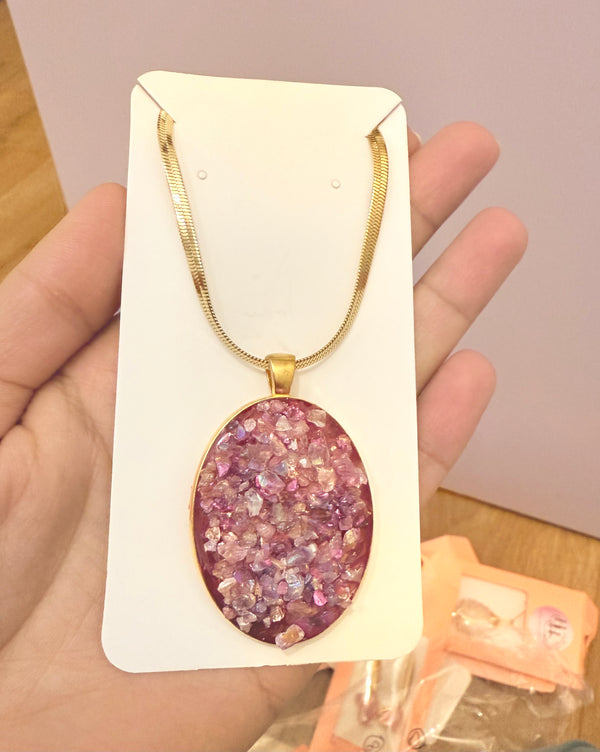 Pink crushed glass resin pendant with snake gold chain
